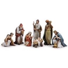 the nativity figurines are all dressed in different colors