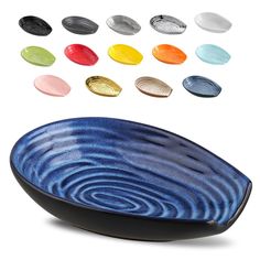 a bowl with different colors and shapes on the side, in front of white background