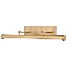 a brass bathroom light with two lights on each side and one light on the other