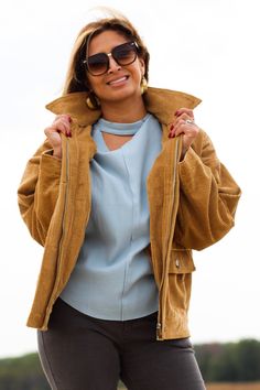 Complete any look with this stylish and comfortable jacket! -Color: Camel -Removable faux fur collared -Button down/ Zip up -Side flap pockets -Oversized silhouette -Content: 100% Cotton -Imported -Model is 5'5" 36-30-40 and wearing a size Small Trendy Utility Jacket For Cold Weather In Fall, Beige Collared Utility Jacket For Winter, Beige Winter Outerwear With Corduroy Collar, Fall Outerwear With Zipper Closure And Lapel Collar, Beige Collared Utility Jacket For Fall, Chic Winter Utility Jacket With Lapel Collar, Chic Utility Jacket With Lapel Collar For Winter, Chic Winter Utility Jacket With Button Closure, Chic Winter Utility Jacket With Pockets