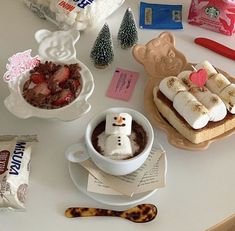 a table topped with desserts and candy