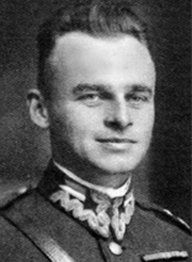 an old black and white photo of a man in uniform