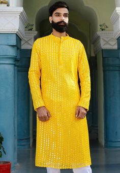 Faux Georgette Kurta in YellowThis Readymade attire is Enhanced with Pockets, Mirror Effect and Resham Work. Crafted in Chinese Collar Neck and Full SleeveDo note: Bottom and Footwear shown in the image is for presentation purposes only. Half to one inch may vary in measurement. (Slight variation in actual color vs. image is possible) We sell all kinds of menswear. Mens Kurta | Mens Kurta Pajama | Mens Sherwani | Mens Sherwani Sets | Traditional Menswear | Partywear Menswear | Indian Mens Dresse Traditional Spring Kurta With Sequins, Festive Yellow Embellished Kurta, Embellished Yellow Sets For Spring, Spring Embellished Yellow Sets, Yellow Long Sleeve Kurta With Mirror Work, Fitted Sequin Kurta For Festivals, Yellow Kurta With Mirror Work For Party, Yellow Mirror Work Kurta For Party, Fitted Embellished Yellow Traditional Wear