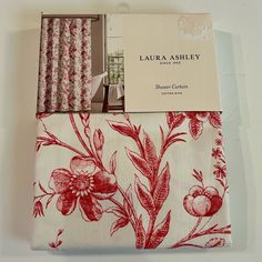 the fabric has red flowers on it and is next to a box that says, lauren ashley