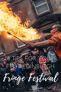 a man holding a fire stick with the words 8 tips for your first edinburgh fringe festival