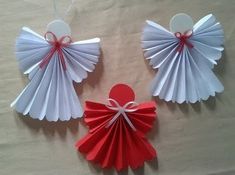 three red and white paper fan shaped decorations