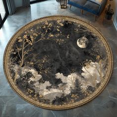 a round rug with an image of trees and moon in the night sky on it