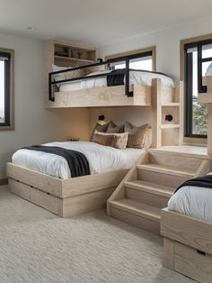 a bedroom with bunk beds and stairs leading to the upper bed area, along with two windows