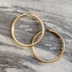 * ZOOM for better detail * Water safe The classic hoop earrings, they'll never go out of style. These hoops measure 2mm in width! ♥️ Sold individually or as a bundle. FEATURES: - 14k Gold Filled MEASUREMENTS: - Hoops measure (from smallest to largest): .75 inch, .90 inch, and 1.2 inch. Medium Hoop Earrings, Real Gold Jewelry, Big Hoop Earrings, Gold Filled Hoops, Jewelry Cleaner, Gold Chain Necklace, Dainty Jewelry, Out Of Style, Go Out