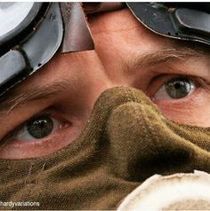 a man with goggles and gloves on his face