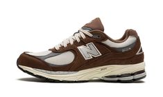 The New Balance 2002R “Brown/Beige” is a versatile, earth tone colorway of the retro running and lifestyle shoe.  The New Balance 2002R was introduced in 2010 as a running shoe before returning as a casual lifestyle shoe in the 2020s.  The “Brown/Beige” features a cream mesh base with brown suede overlays and grey leather overlays.  A grey “N” logo appears on either side of the shoe.  Silver “2002R” branding is found on the lateral heel.  The shoe is finished off with a cream foam midsole that g Brown Running Shoes, Retro Brown Sneakers For Sports, Brown Running Shoes With Cushioned Footbed And Round Toe, Casual Brown Running Shoes For Sports, Casual Brown New Balance Running Shoes, Brown Streetwear Running Shoes With Vibram Sole, Brown Sports Sneakers With Air Cushioning, Brown New Balance Running Shoes For Sports, New Balance Brown Running Shoes For Sports