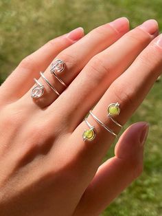 Elegant handmade rings crafted from silver-plated wire and natural round gemstones. 🌞🌱 Welcome to our newly launched shop! We are excited to have You here. Your support means a lot to us and helps us grow🌱🌞 💍 About the rings: - Can be slightly adjusted by twisting the wire to fit - Exceptional comfort - No snagging on clothing or hair - Versatile, suitable for various outfits and occasions - Perfect for gifting 🔨 About the materials: - The wire is designed not to cause skin discoloration, Hand-wrapped Sterling Silver Crystal Ring, Round Sterling Silver Wire Wrapped Crystal Ring, Adjustable Wire Wrapped Sterling Silver Crystal Ring, Adjustable Sterling Silver Wire Wrapped Crystal Ring, Stone Rings For Women, Hippie Summer, Summer Rings, Spiral Ring, Clear Nail Polish