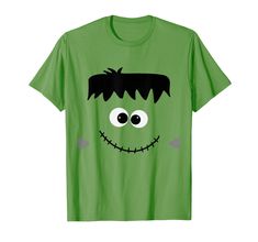 a green t - shirt with a face drawn on it