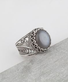 Handmade Genuine Gray Moonstone 925 Sterling Silver Artisan Crafted Filigree Ring Material: 925 Solid Sterling Silver Genuine Gray Moonstone Gemstone Dimensions: 10 mm x 12 mm, Oval, Cabochon Ring Face Length: 0.60 inches Ring face width: 0.50 inches This ring will come in a designer pouch, put in gift box and a romance card. Free Domestic Shipping It is a gift that will create memories for years to come. Our fine silver jewelry is made in our exclusive artisan workshops in Turkey. Our aim is to Silver Cocktail, Fine Silver Jewelry, Cabochon Ring, Filigree Design, Moonstone Ring, Jewelry Gift Box, Gemstone Ring, Bracelet Designs, Beautiful Bracelet