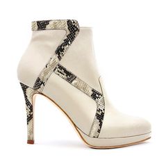 Elevate your rotation with these ivory Deia ankle boots, highlighted with striking python-effect trims that accentuate their sleek panels. Handcrafted in Florence, the heart of Italian shoemaking, they’re set on an elongating heel and comfortable platform sole. Secured with a polished gold zip for effortless on-and-off wear, pair them with a white bodycon dress for timeless daytime glamor that seamlessly transitions into the night. Elizée shoes are crafted of exquisite quality Italian leather, which will last forever with the right care and attention.  Apply a high quality leather protector (or a suede protector, for suede) to the entire upper of your shoe, taking care to follow the instructions on the label. Store your shoes in a cool, dry place, out of direct sunlight.  Use the Elizée du Comfortable High Heels, Leather High Heel Boots, Fashionable Shoes, White Bodycon, White Bodycon Dress, Into The Night, Python Print, Leather High Heels, Color Ivory