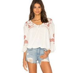 Free People Chiquita Ivory Embroidered Combo Peasant Top Small Brand: Free People Size: Small Size Type: Relaxed Style: Chiquita Embroidered Type: Peasant Top Color: White Red Black Neckline: V Neck Material: 100% Cotton Pattern: Embroidered Trim Sleeve Length: Flutter Bell Sleeve Features: Lightweight, Boho Closure: Front Lace-Up Tie Condition: Pre-Owned, In Good Condition. *Some Few Loose Thread Barely Noticeable Measurement: Chest Size: 20” Length: 22” - We Sell Nwt / Pre Owned, Clean No Flaw White Bohemian Peasant Top With Chikankari Embroidery, Casual White Embroidered Peasant Top, White Folk Style Embroidered V-neck Top, White Bohemian Peasant Top For Beach, White Chikankari Embroidery Peasant Top, Casual Embroidered Off White Tops, White V-neck Peasant Top With Floral Embroidery, White Casual Peasant Top With Floral Embroidery, Casual White Peasant Top With Floral Embroidery