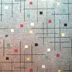 an image of a wall with squares and dots painted on it in different colors or shapes