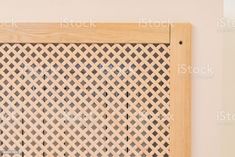 a close up view of a wooden door frame with lattice pattern on it stock photo