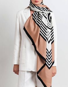 Elegant large silk scarf with Heijne signature logo. The graphic motiv in black and creme contrast beautifully with the warm camel color. Wear it loosely draped over your shoulders with your coat or tie as top or skirt. Our newest scarves are printed on both sides of the fabric. That means that the back side is equally beautiful as the front side.Material and size Material: 100% silk twill Measurements: 135 cm x 135 cm Care instructions low-middle iron hand wash delicate machine wash no bleach d Graphic Scarf, Large Silk Scarf, Swedish Fashion, Fashion Week 2016, Garment Industry, Large Scarf, Personalized Clothes, Camel Color, Wool Suit