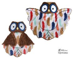 two owls made out of fabric with eyes and feathers on the front, one has an owl