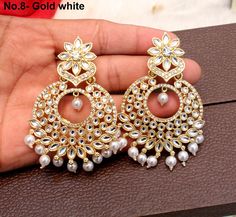 *Light weight kundan earrings. *No.1 *Earrings length- 2.7 inches (Included drops) *Earrings breadth- 1.7 inches *No.2 *Earrings length- 2.7 inches (Included drops) *Earrings breadth- 1.7 inches *No.3 *Earrings length- 2.7 inches (Included drops) *Earrings breadth- 1.7 inches *No.4 *Earrings length- 2.8 inches (Included drops) *Earrings breadth- 1.7 inches *No.5 *Earrings length- 2.8 inches (Included drops) *Earrings breadth- 1.7 inches *No.6 *Earrings length- 2.9 inches (Included drops) *Earrin Heavy White Drop Bridal Earrings, White Chandbalis Drop Earrings As Gift, White Chandbali Earrings, White Kundan Round Danglers, White Kundan Danglers, Nath Bridal, 4 Earrings, 3 Earrings, Indian Nose Ring