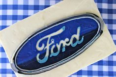 a blue and white cake with the word ford on it