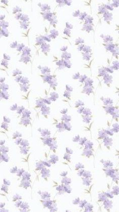 a white and purple flowered wallpaper with small flowers