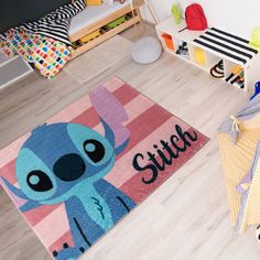 Kids and Parents will love the softness yet easy-care quality of this new collection of Licensed Rugs by Gertmenian. Who does not like this cute stranger from another planet? Any Stitch fan will love this soft and durable printed rug measuring 40"x54" Soft to the touch and easy to care, this rug is out of this world. Disney Stitch 3 X 5 (ft) Stitch Pink Indoor Area Rug | 19838 Lilo And Stitch Room Decor, Stitch Kitchen, Disney Room Decor, Another Planet, Lilo Et Stitch, Printed Rug, Solid Color Rug, Area Rug Blue, Light Blue Rug