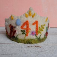 a felt crown with the number four on it