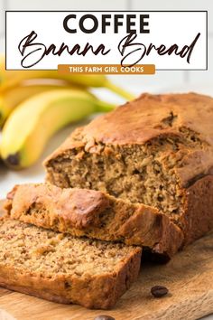 a loaf of banana bread sitting on top of a wooden cutting board next to bananas