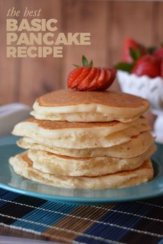 a stack of pancakes on a blue plate with strawberries in the background and text overlay