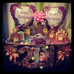 a birthday cake with candles and decorations on it's display shelf, which is also for sale