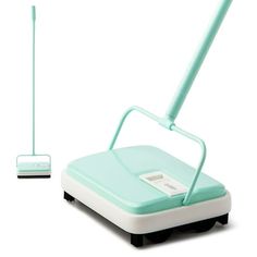 a blue and white floor sweeper sitting on top of a table