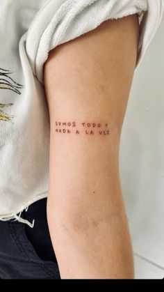 a woman's arm with the words happy to be tattooed on it