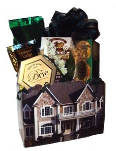 Cardboard box printed like a house filled with popcorn, pretzels, crackers, cheese, coffee, and nuts Cheese Pretzels, Home Gift Basket, Popcorn Cookies, Baskets Gifts, New Home Owners, Home Owners, Sun Valley, Realtor Gifts, New Homeowner