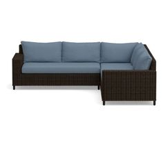 an outdoor sectional sofa with pillows on it's back and seat cushions in front