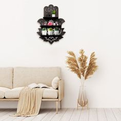 a living room with a couch, coffee table and potted plants