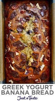 a loaf of bread with chocolate chips and nuts on top, in a baking pan