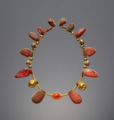 Necklace with a Pendant Scarab, Italic or Etruscan, 550–400 B.C. Amber, gold, and carnelian. Ancient Roman Jewelry, Roman Jewelry, Getty Museum