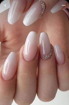 a woman's hand with some white and pink nails