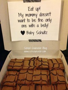 some brownies are in a box with a sign on the side that says eat up my mommy doesn't want to be the only one with a bellyy baby sonutz