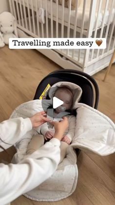 a baby in a car seat being held by someone's hand with the caption traveling made easy