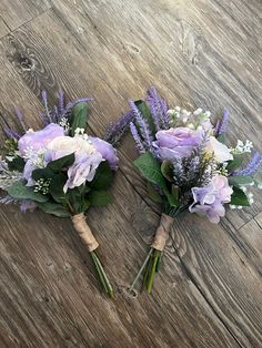 two bouquets of purple flowers are laying on the floor next to eachother