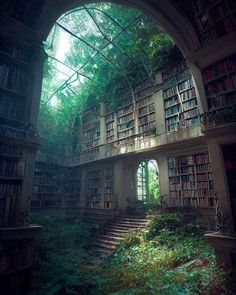 an abandoned library with lots of bookshelves and stairs leading up to the second floor