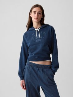 Soft cotton cropped hoodie.  Hooded neckline with drawcords.  Long sleeves with banded cuffs.  Gap arch logo at front.  Front kanga pocket.  Banded hem.  This product was made in a factory that invests in gender equality and women’s empowerment.  Through RISE Reimagining Industry to Support Equality) and Gap Inc. ’s program P. A. C. E.  Personal Advancement & Career Enhancement), we support people who make our clothes to build the skills, knowledge, confidence, and resilience needed to advance i Blue Prada, Hoodie Gap, Arch Logo, Hoodie Streetwear, Slim Fit Casual Shirts, Gender Equality, Gap Women, Swimwear Cover Ups, Swimwear Cover