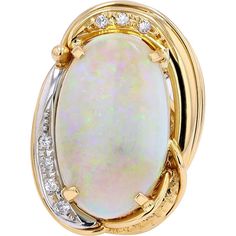 Revel in the rhythm of radiance with our Enchanting Opal Oval Ring, a dazzling testament to elegance and sophistication. Crafted in the finest 18K yellow gold and platinum, this exquisite ring features a mesmerizing opal as its centerpiece, boasting a total carat weight of 6.69 Carats. The opal's ethereal play-of-color captivates the eye with hues of blues, greens, and purples, evoking a sense of mystery and allure. Delicate diamonds, totaling 0.09 Carats, accentuate the opulent beauty of the opal, adding a touch of brilliance and sparkle to this enchanting piece.Whether worn for a special occasion or as an everyday statement piece, this ring exudes timeless charm and sophistication. Its unique design and exceptional craftsmanship make it a treasure to be cherished for generations to come. Luxury Classic Oval Cabochon Opal Ring, Luxury Oval Art Deco Opal Ring, Diamond Birthstone, Oval Ring, Oval Rings, Opal Jewelry, Precious Gemstones, Gold Platinum, Opal Rings