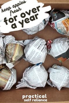 an open box filled with paper balls and the words keep apples fresh for over a year