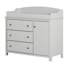 a white dresser with two drawers and a baby crib in the middle, against a white background