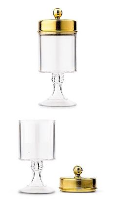 three glass and brass table lamps on white background