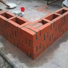 two men are working on a brick wall